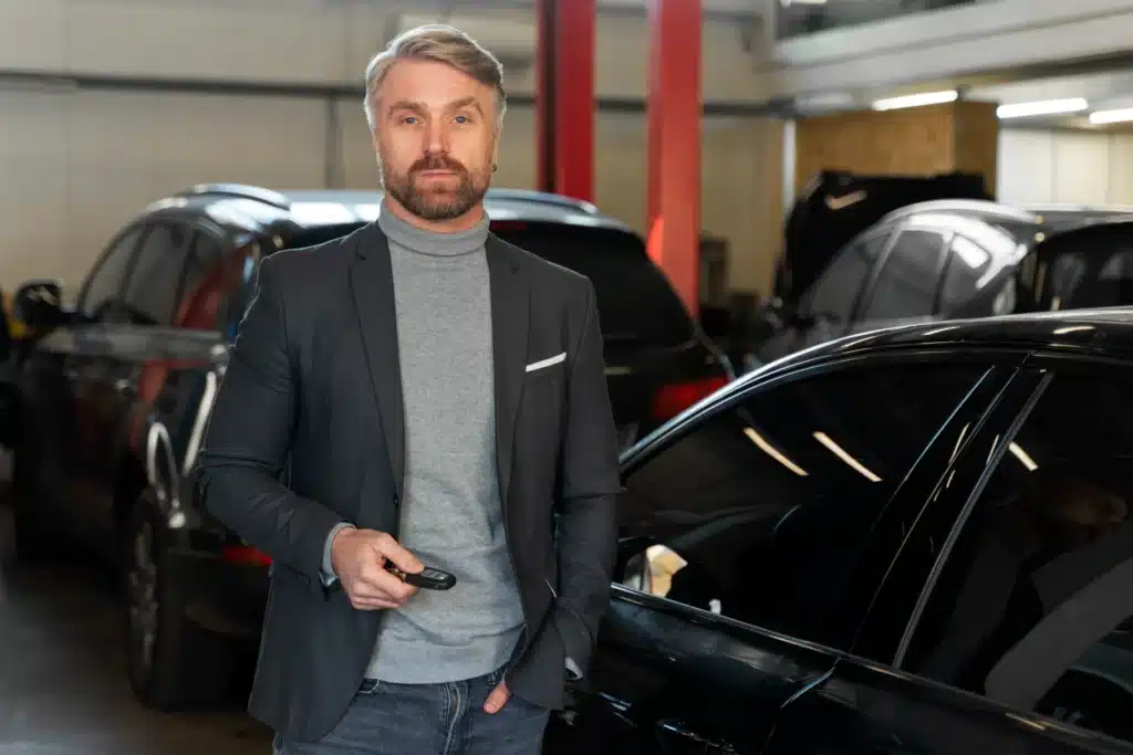 front view man repairing workshop